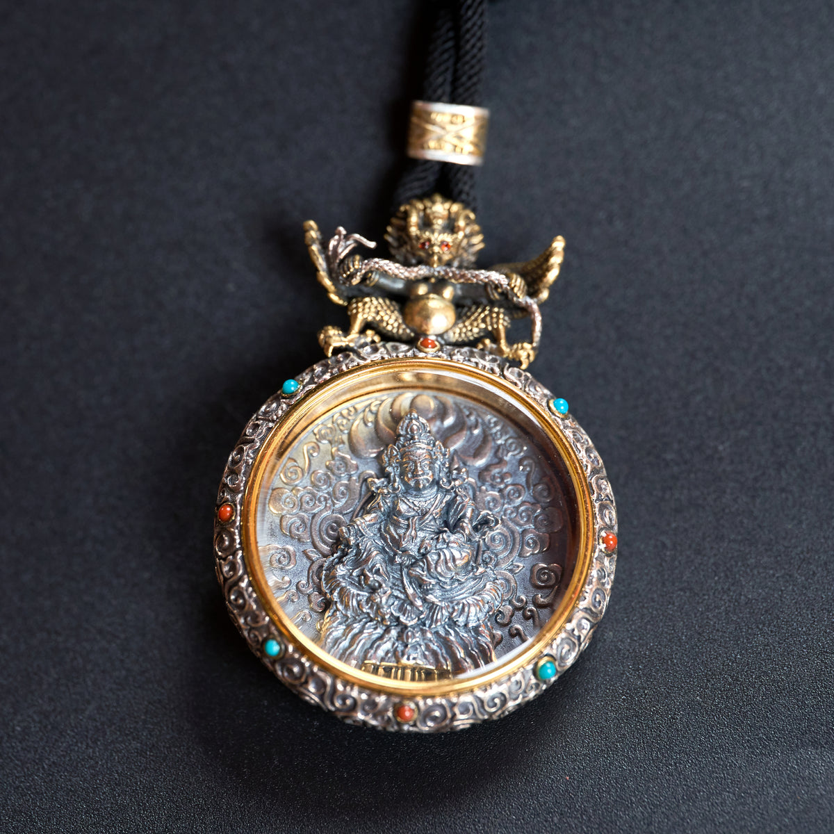 Tibetan silver carved Buddha pendant
